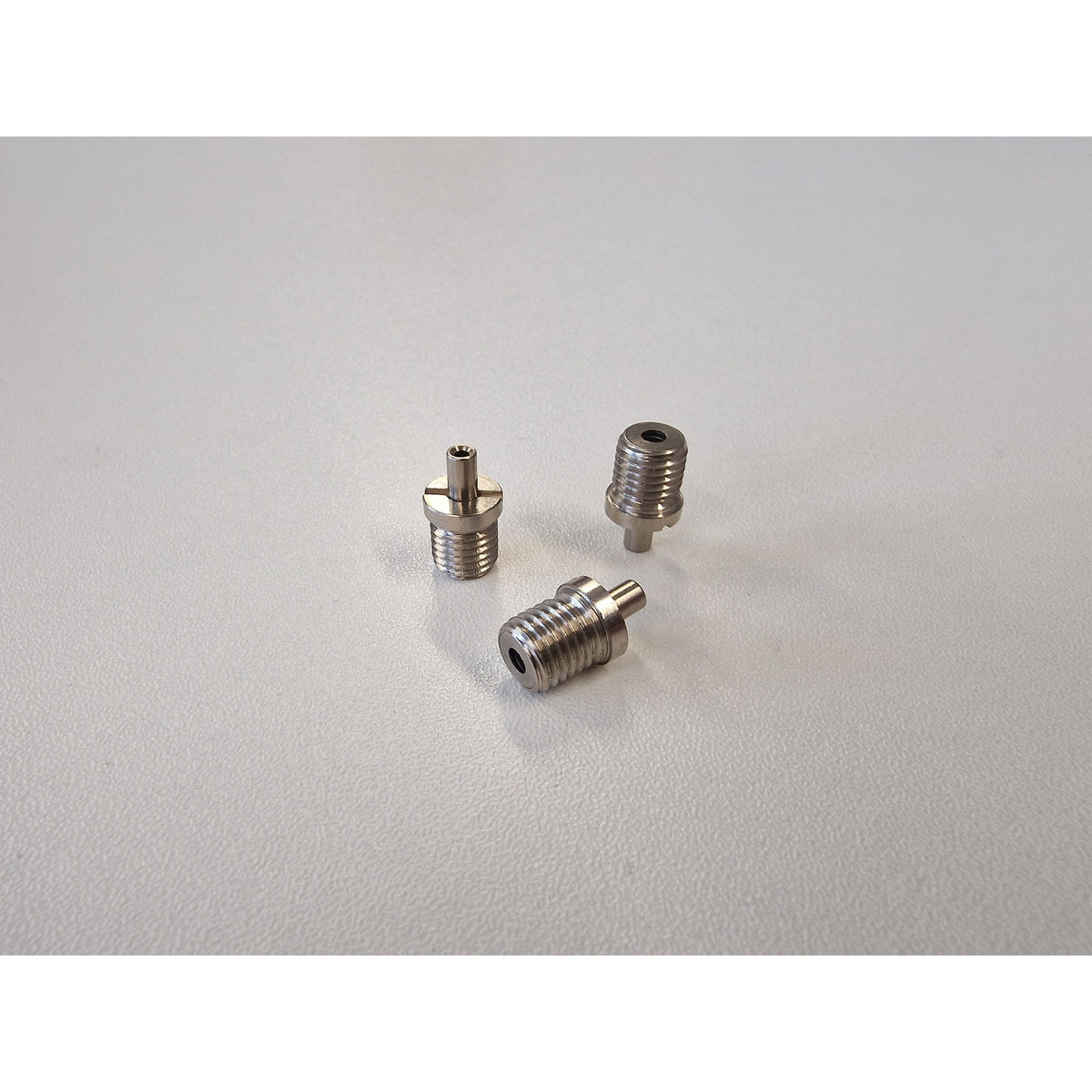 3 Metallic TECNI cable Grippers on a white background 170.012.002