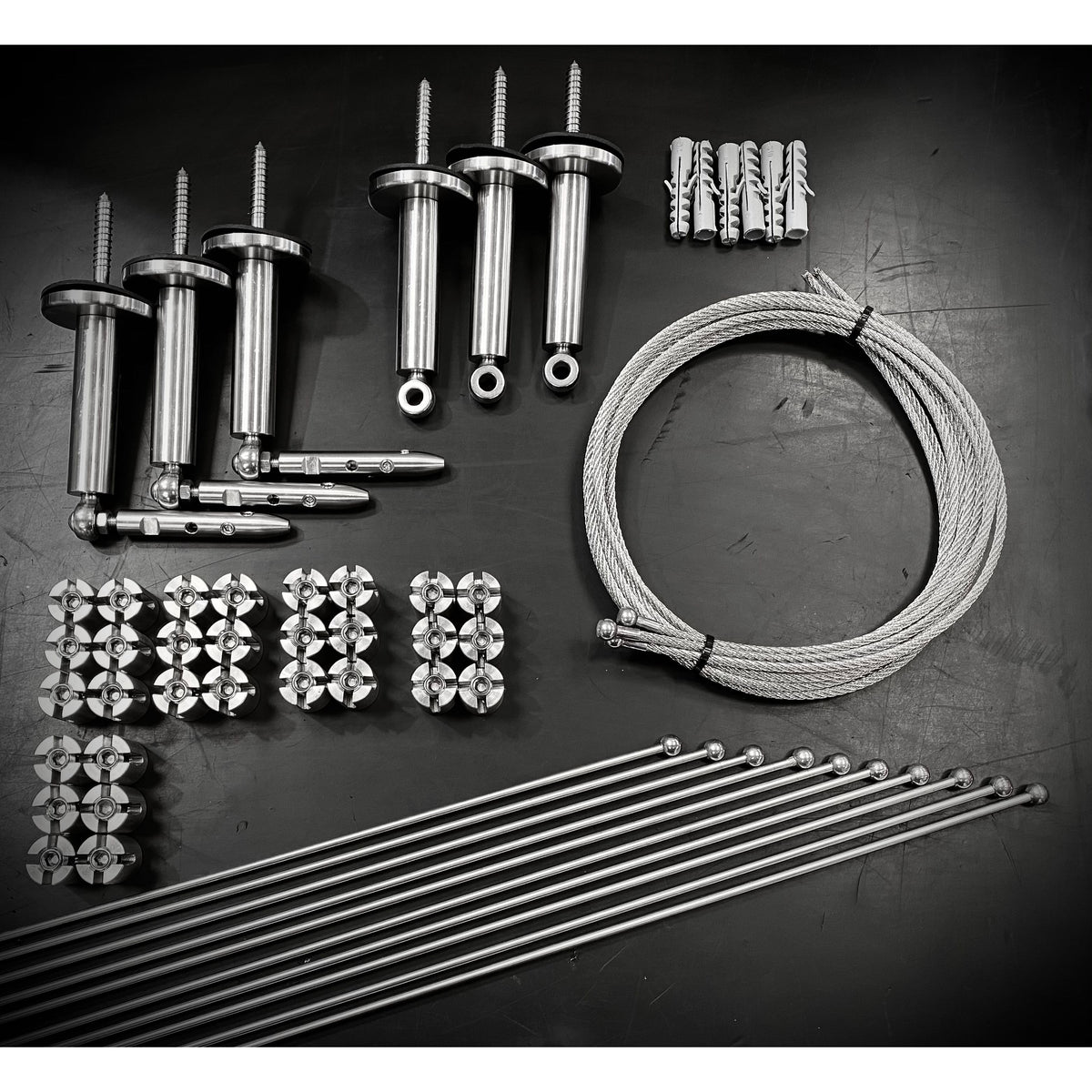 Photo showing the components of a trellis kit on a workbench showing different sizes.