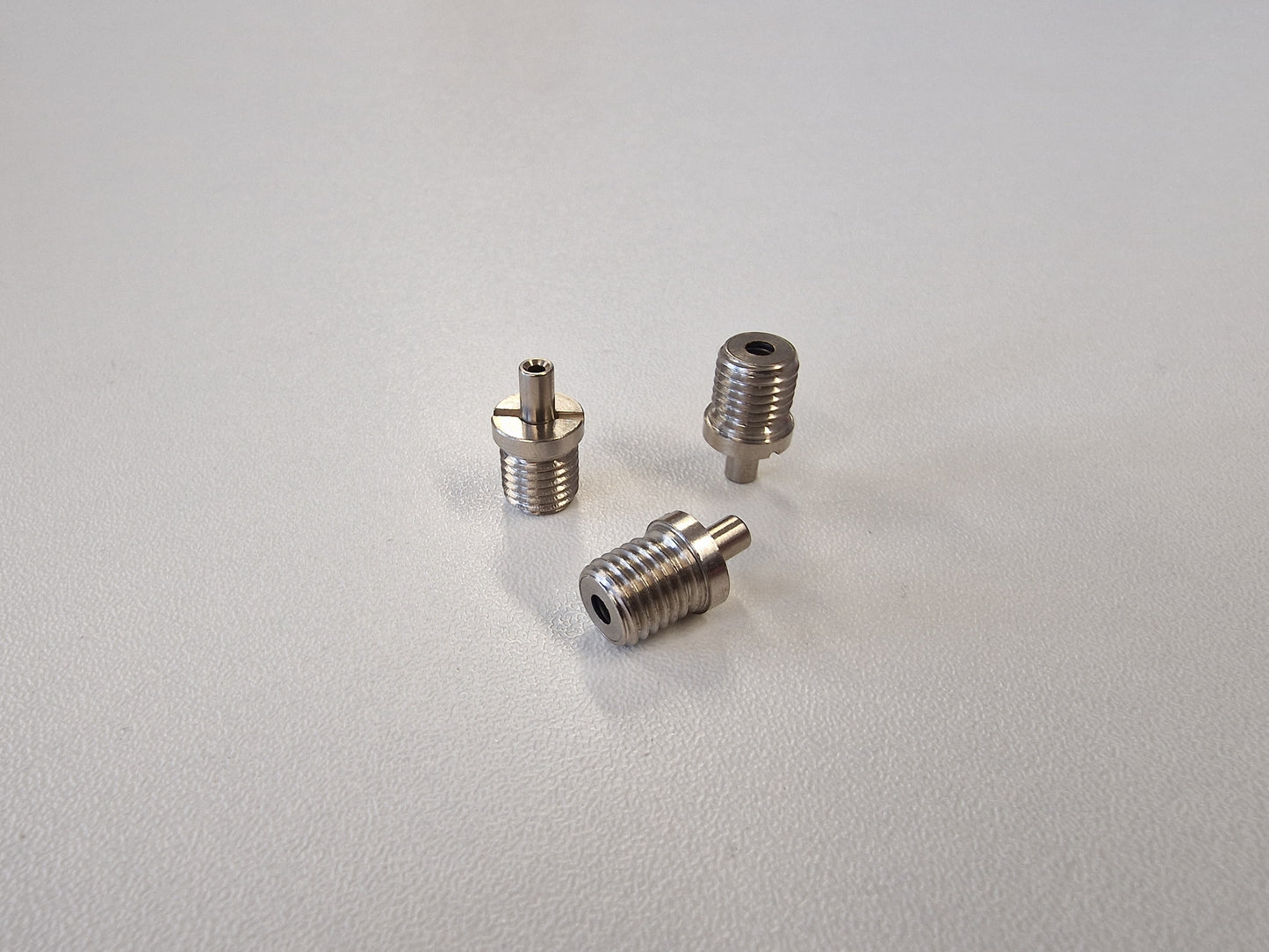3 Metallic TECNI cable Grippers on a white background 170.012.002