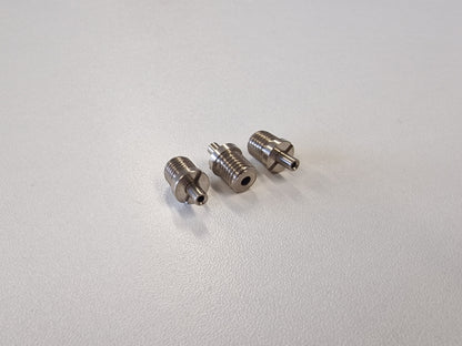 Three Metallic TECNI cable Grippers on a white table 170.012.002