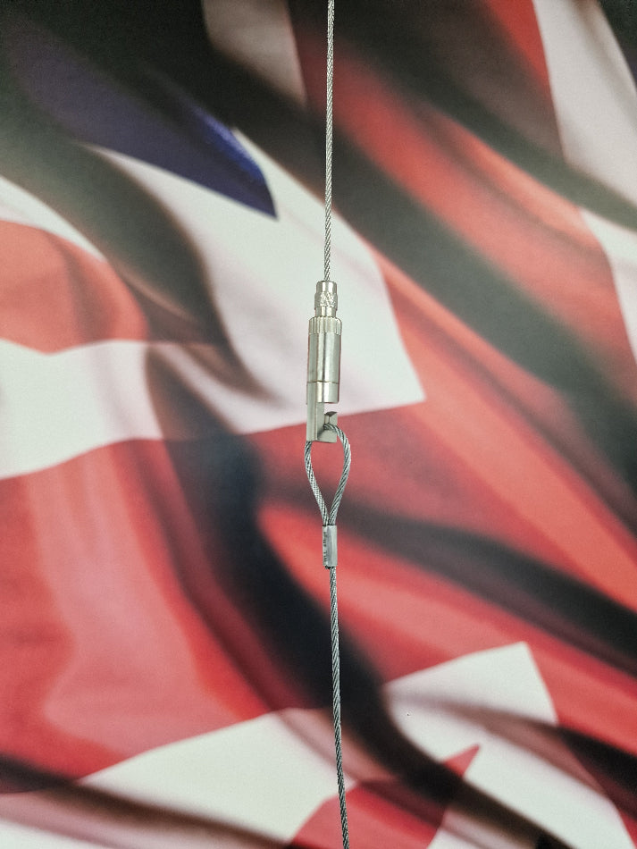 Metallic Gripper hook on a blurred background of a flag