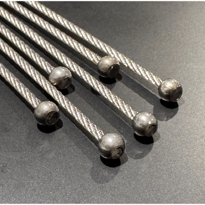 Manufactured wire rope assemblies with a ball end on a black background