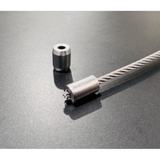 Wire rope with a Mil Spec Stop fitting on the end.