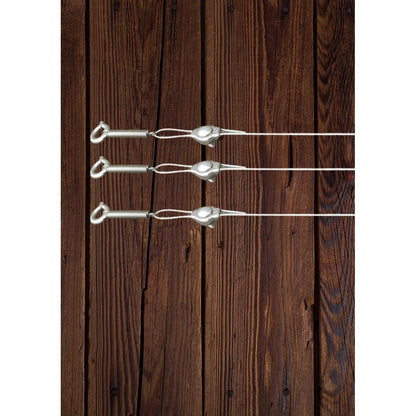 Metallic spring loaded 0.7mm cable  tension system on a wooden fence used to support climbing plants. TECNI 802.000.